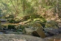 Rock over the waterway. Beauty in the nature. Tropical rainforest in Thailand. Waterfall in summer season. Royalty Free Stock Photo