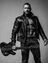 Rock this party. Muscular athletic sexy male with guitar. Confident and handsome brutal man play music. Party for adults
