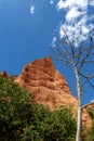 Rock peack and dry dead tree at the Las Medulas historic gold mining site on a sunny day