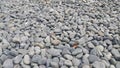 Rock Pebbles, small, rounded, smooth rocks. Texture background for text Royalty Free Stock Photo