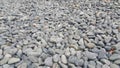 Rock Pebbles, small, rounded, smooth rocks. Texture background for text Royalty Free Stock Photo