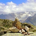 Rock pile cairn indicate the way on a mountain square format Royalty Free Stock Photo