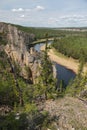 Rock pillars and river in taiga fores