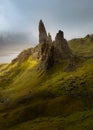 The breathtaking Old Man of Storr pinnacles on the Isle of Skye with dark moody clouds in background. Royalty Free Stock Photo