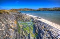 Rock pool Morar coast Scotland UK beautiful coastal Scottish tourist destination in colourful HDR Royalty Free Stock Photo