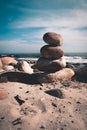 Rock pyramid on the beach by the seaside