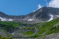 Rock ridge with snow and stone placers Royalty Free Stock Photo