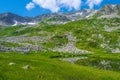 Rock ridge with snow and stone placers under blue sky Royalty Free Stock Photo