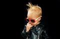 Rock and roll fashion trend. Little child boy in rocker jacket and sunglasses. Little rock star. Rock style child Royalty Free Stock Photo