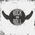 Rock and Roll music print. Grunge print for T-shirt with lettering and wings in guitar form Royalty Free Stock Photo