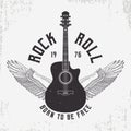 Rock and Roll t-shirt design with guitar and wings. Typography graphics for tee shirt with slogan and grunge. Vintage apparel Royalty Free Stock Photo