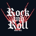 Rock and Roll t-shirt design. Hand of skeleton with lettering on dark background. Vintage t-shirt graphic Royalty Free Stock Photo