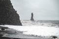 Rock sculpture with heavy waves at Black Sand Beach Reynisfjara, Iceland Royalty Free Stock Photo