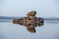 Rock Sculpture With Reflection In Lake