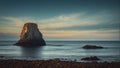 lonely high rock like an island stands near the shore of a calm, quiet sea Royalty Free Stock Photo