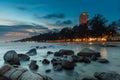 The rock and the sea in the color of sunset time Royalty Free Stock Photo