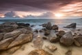 The rock and the sea in the color of sunset time. Royalty Free Stock Photo