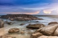 The rock and the sea in the color of sunset time. Royalty Free Stock Photo