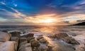 The rock and the sea in the color of sunset time. Royalty Free Stock Photo