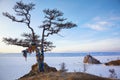 Rock Shamanka on Olkhon island in lake Baikal in winter Royalty Free Stock Photo