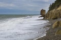 A rock in the shape of a sail on the black sea coast of Russia near the village of Praskoveyevka. Winter, storm, waves Royalty Free Stock Photo