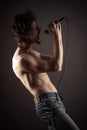 Rock singer performs with naked torso Royalty Free Stock Photo