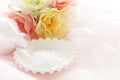 Rock slat on white plate with artificial flower