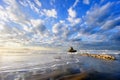 Rock in Sopelana beach with beautiful clouds Royalty Free Stock Photo