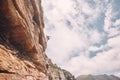 Rock, sport and mountain adventure man climber free climbing rocks in the mountains. Sports person in nature on a Royalty Free Stock Photo