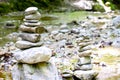 Two rock stacks in a creek bed, piles of stacked rocks