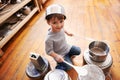 Rock star in the making. High-angle view of a young boy playing drums on pots and pans. Royalty Free Stock Photo