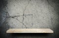rock stone display shelf on crack cement wall Royalty Free Stock Photo