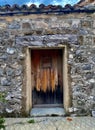 Rock and stone framed wood door Royalty Free Stock Photo