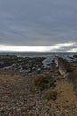 Rock strata dipping into the Sea at St Monan\'s on the Fife Coast, next to the outer Breakwater of the small harbour