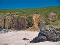 Rock strata are visible above rock debris after a coastal land slip on a beach near the Butt of Lewis on the Isle of Lewis