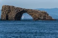 Rock structure provides window to the mainland Royalty Free Stock Photo