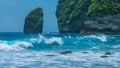 Rock in Tembeling Coastline at Nusa Penida island, Ocean Waves in Front. Bali Indonesia