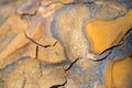 Rock texture and surface background. Cracked and weathered natural stone background.Fragment of a wall from a chipped stone Royalty Free Stock Photo