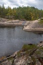 Rock textures are highlighted on cascade pool in Algonquin Park Royalty Free Stock Photo