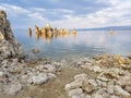 Rock tufa towers in the lake at sunset