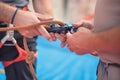 Rock wall climber wearing safety harness and climbing equipment indoor, close-up image Royalty Free Stock Photo