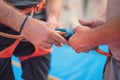 Rock wall climber wearing safety harness and climbing equipment indoor, close-up image