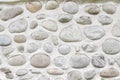 Rock wall of natural river stones. Round stones wall background. River round Stones pattern. Stones texture. River rocks backgroun