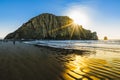 Rock in the water, sunset on the beach, Moro Bay, California Royalty Free Stock Photo