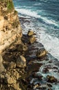 Rock and wave beside the cliff at seaside Royalty Free Stock Photo