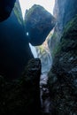 Rock Wedged Above Water Fall