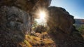 Rock window in mountain with sun