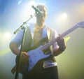 Rock on. A young musician performing on stage at a music festival. Royalty Free Stock Photo