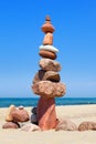 Rock zen pyramid of colorful pebbles on the background of the sea. Concept of balance, harmony and meditation Royalty Free Stock Photo