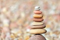 Rock zen pyramid of white, red and yellow stones. Concept of balance, harmony and meditation